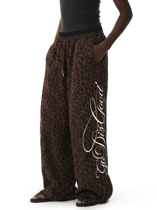 FDR Studios leopard print baggy sweatpants with gothic script embroidery