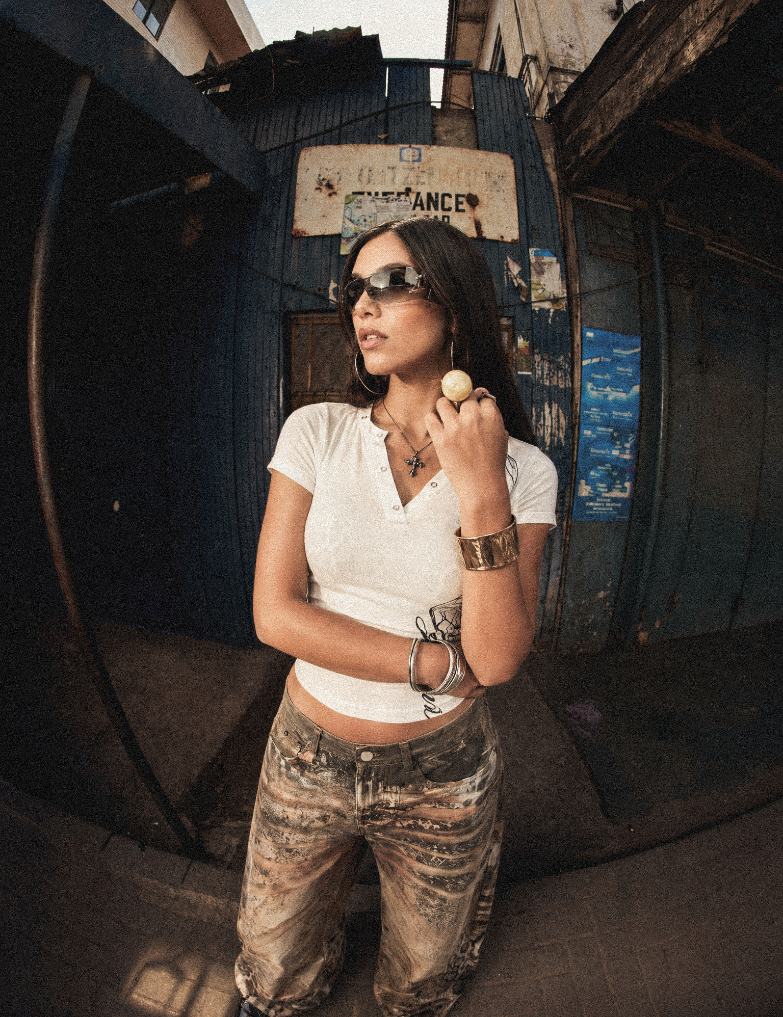High-street fashion model wearing Cyber Y2K crop top and techwear style pants