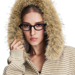 Close-up of model wearing fur-trimmed hooded jacket, highlighting fuzzy texture and ribbed fabric details.