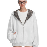 Front view of grey hoodie on model, highlighting cat ears on hood and full-length zipper detail.