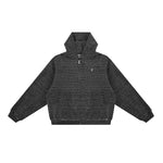 Studio flat lay of the black textured hoodie, highlighting the high-performance material and minimalist streetwear design.