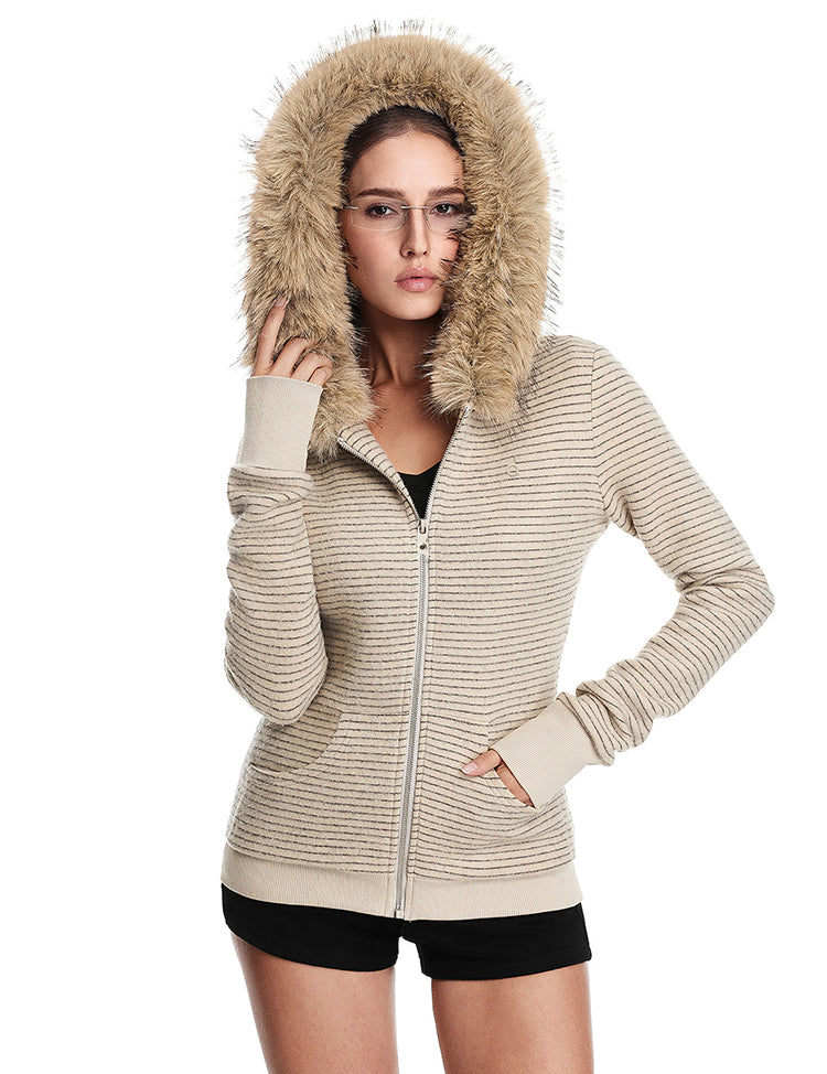 A front view of a model wearing a closed cream-colored ribbed-knit jacket with a large brown faux fur-trimmed hood, showcasing the texture.