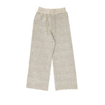 Studio flat lay of the cream-colored textured wide-leg pants on a white background, showing the full length and elastic drawstring waistband.