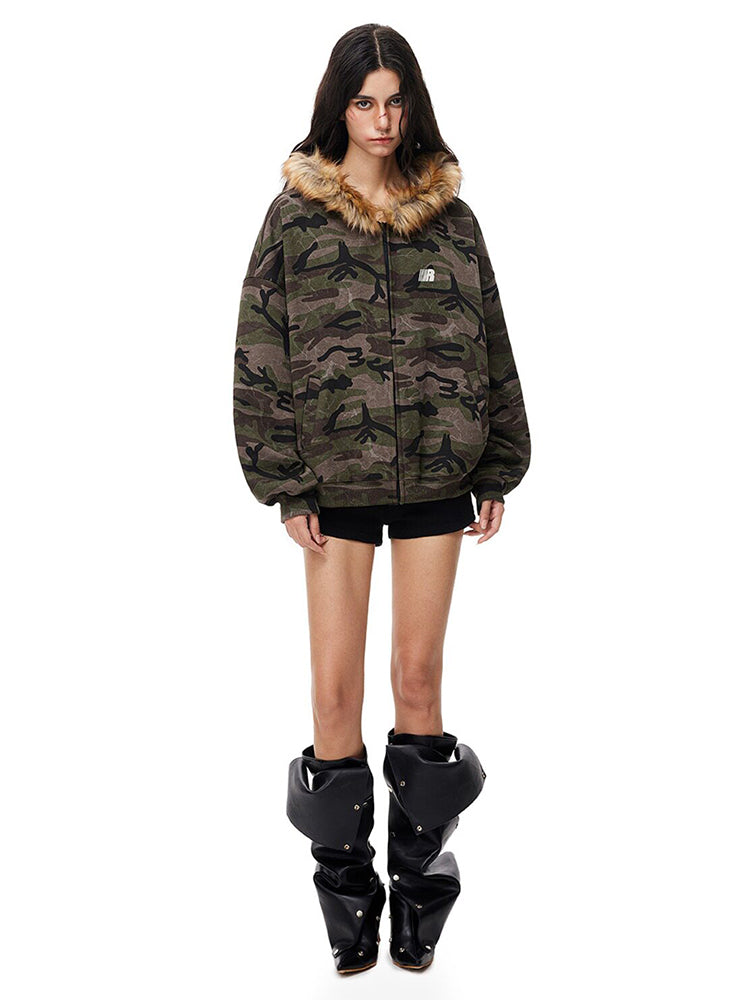 Straight-on full view of camo zip-up jacket showcasing Y2K high-street silhouette.