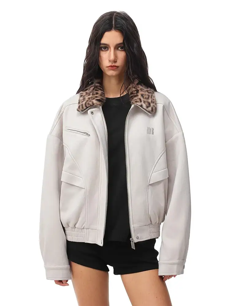 Model wearing off-white cropped jacket with leopard print fur collar over a black top.