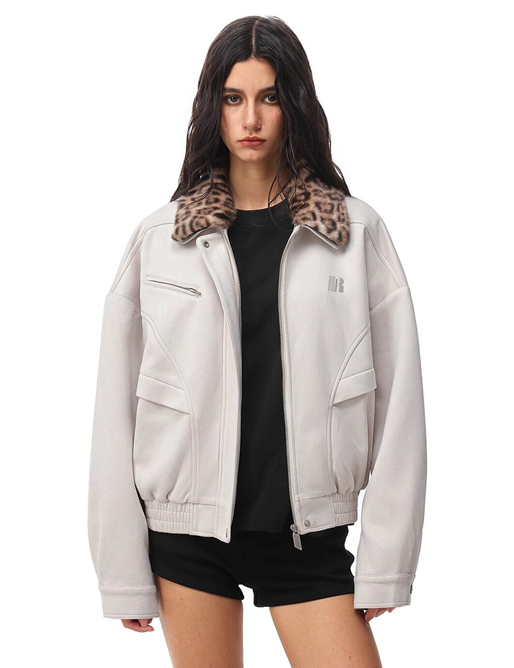 Model wearing off-white cropped jacket with leopard print fur collar over a black top.