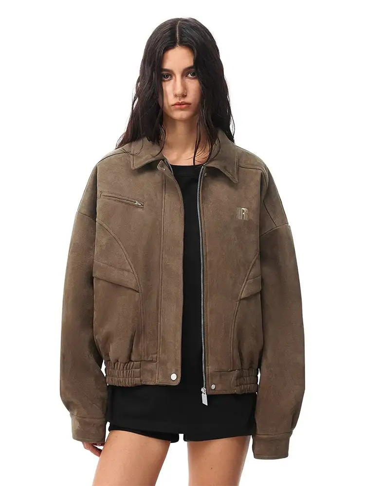 Front view of model in brown oversized work jacket with leopard faux fur collar, utilitarian style.