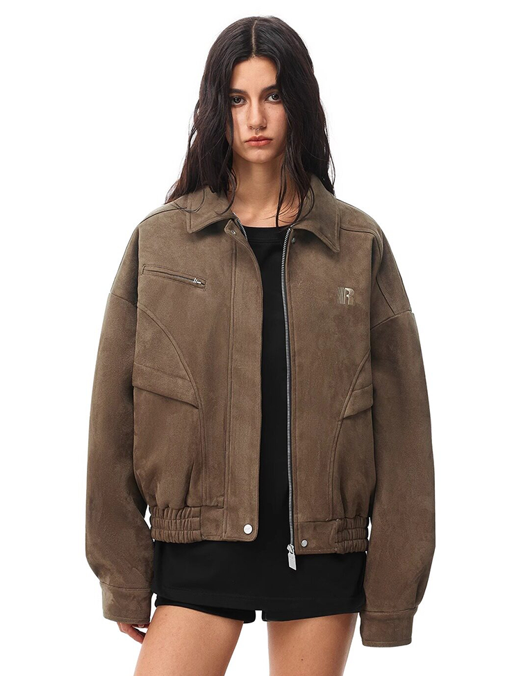 Front view of model in brown oversized work jacket with leopard faux fur collar, utilitarian style.