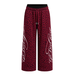 Side angle perspective of Graffiti Leopard Baggy Sweatpants in Red - FDR