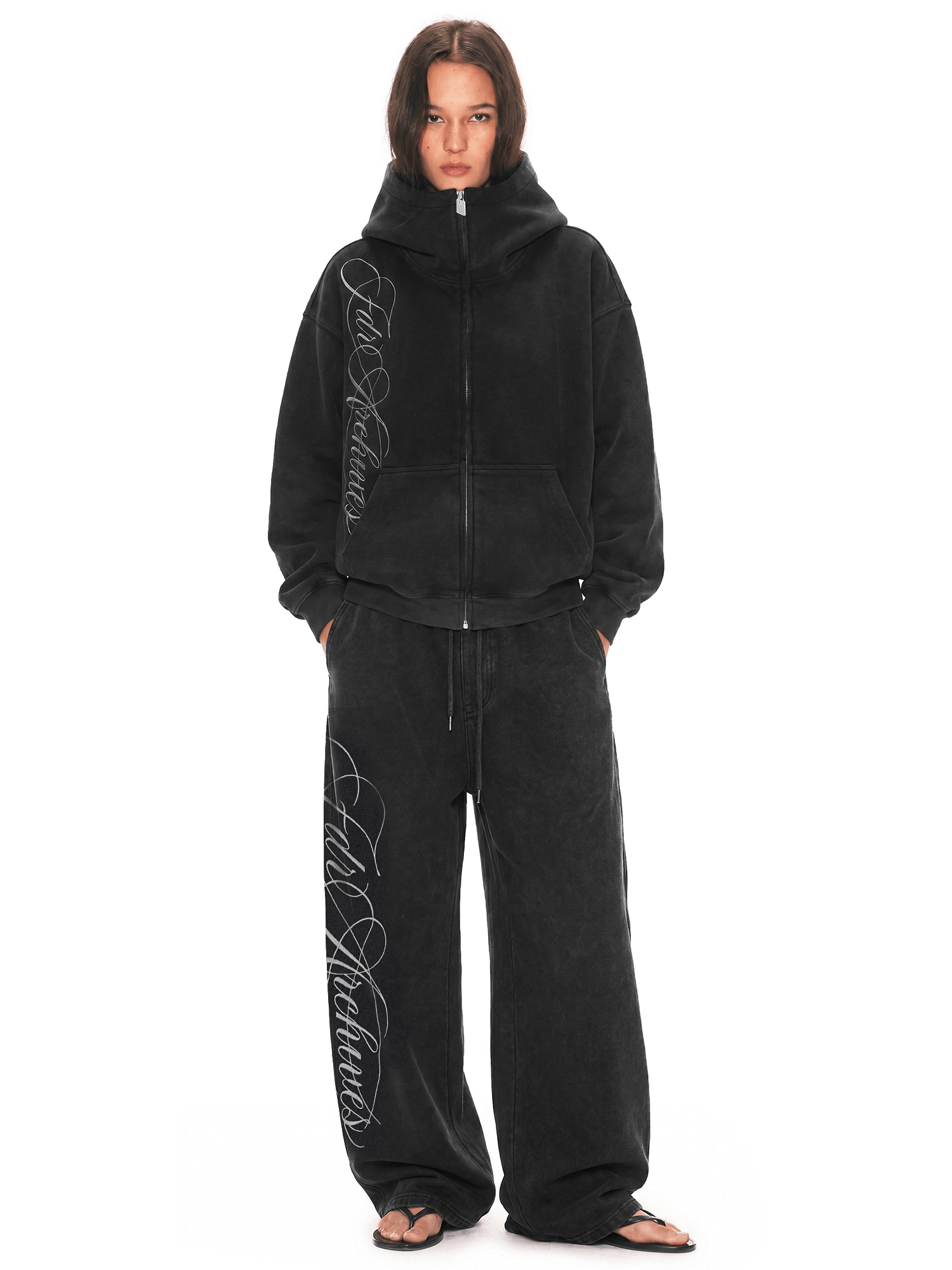 Black zip-up hoodie with big oversized hood and wide-leg baggy sweatpants set, Cyber Y2K streetwear, front full view