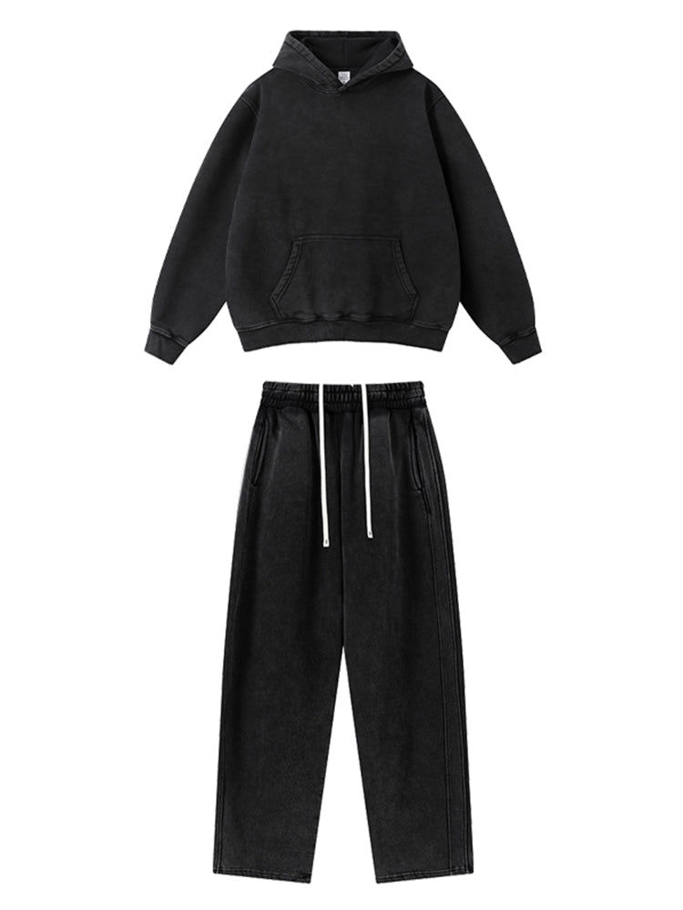 Black oversized hoodie and matching sweatpants set isolated on white