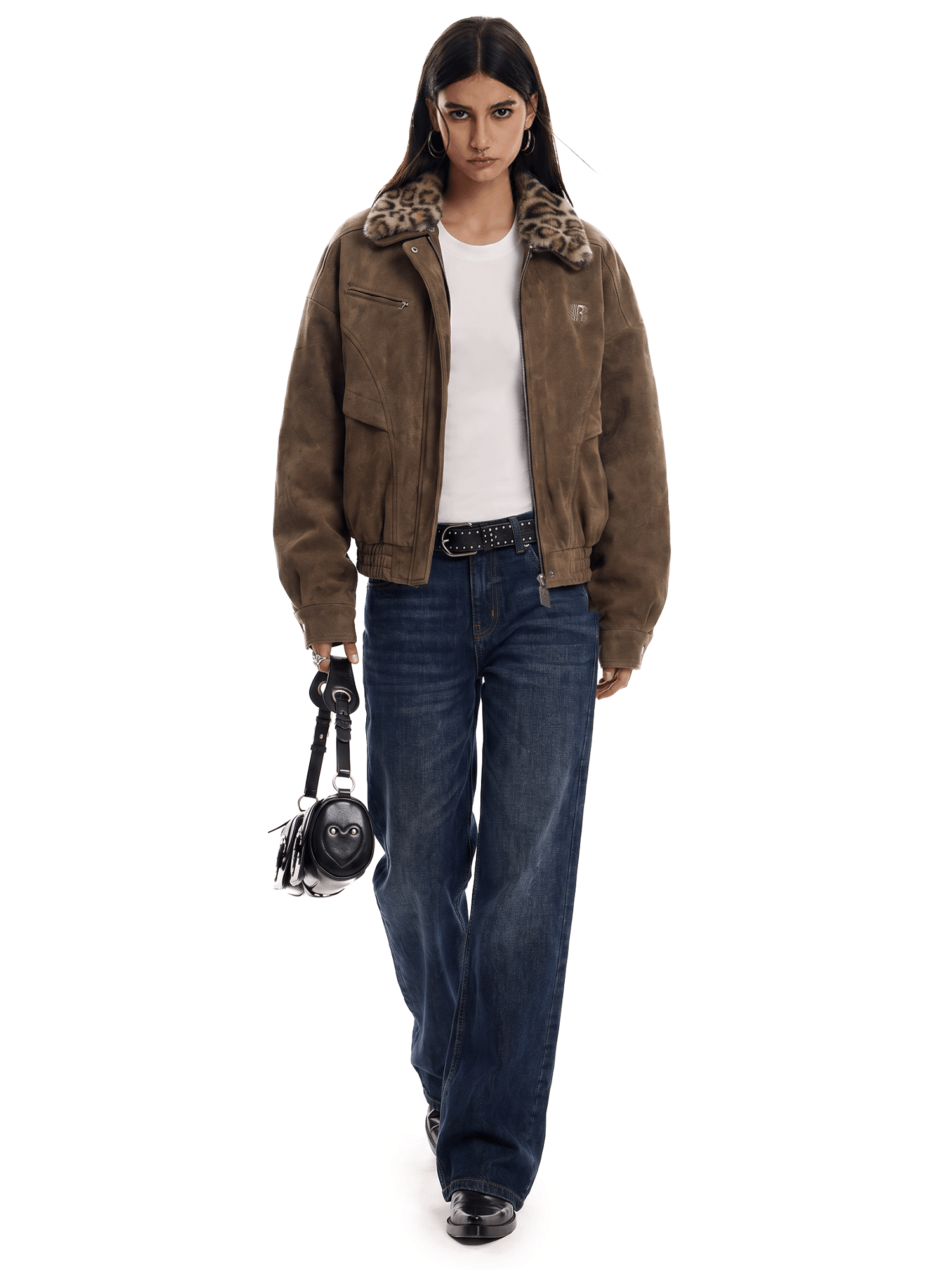 Person wearing a brown jacket with fur trim, white shirt, and blue jeans on a white background