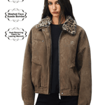 Woman wearing a brown suede bomber jacket with leopard fur collar on a white background