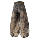 Back view of FDR Studios distressed techwear wide-leg trousers with acid wash texture.