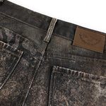 Close-up of distressed denim waistband and pocket detail for high-street fashion brand FDR Studios.