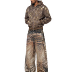 Model wearing FDR Studios techwear aesthetic oversized hoodie and baggy distressed pants.