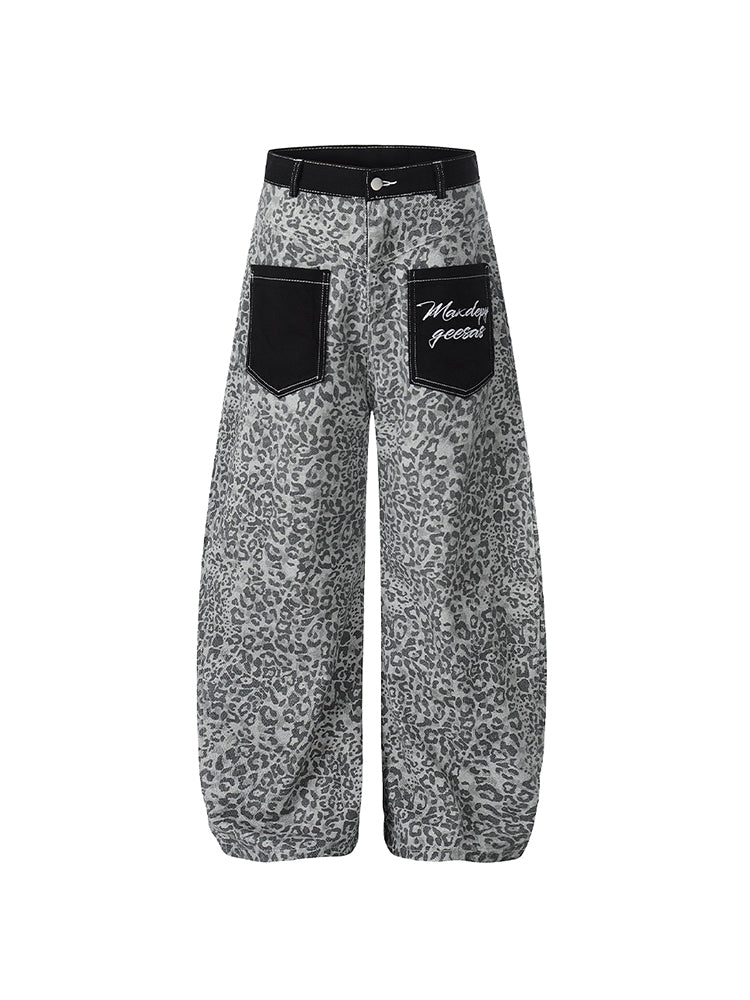 Front flat lay of grey leopard print baggy trousers featuring oversized black utility pockets.