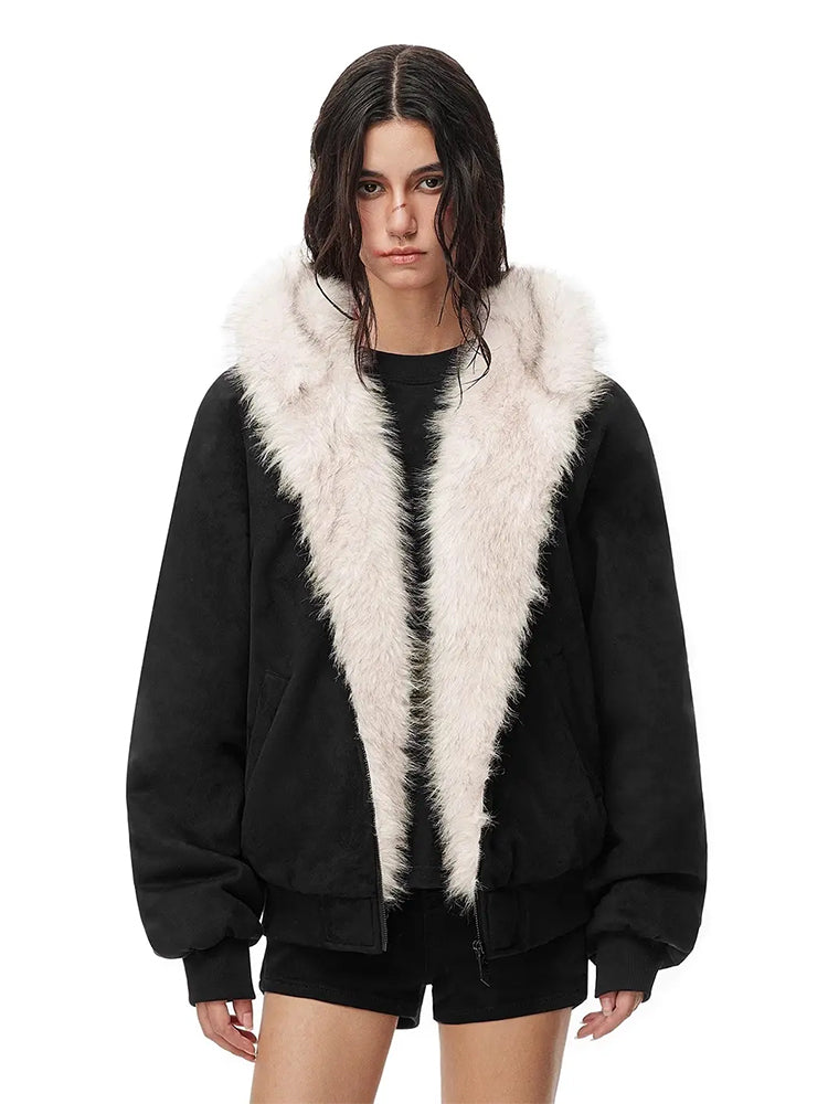 Close-up shot of the plush faux fur trim and collar on a women's black bomber-style jacket.