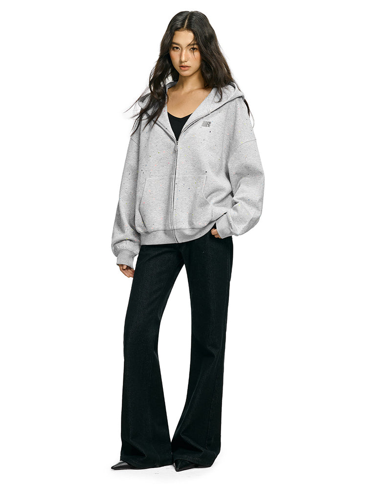Model wearing oversized rhinestone star hoodie in marled grey streetwear style