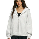 Model in light gray oversized hoodie showing high street y2k fashion style