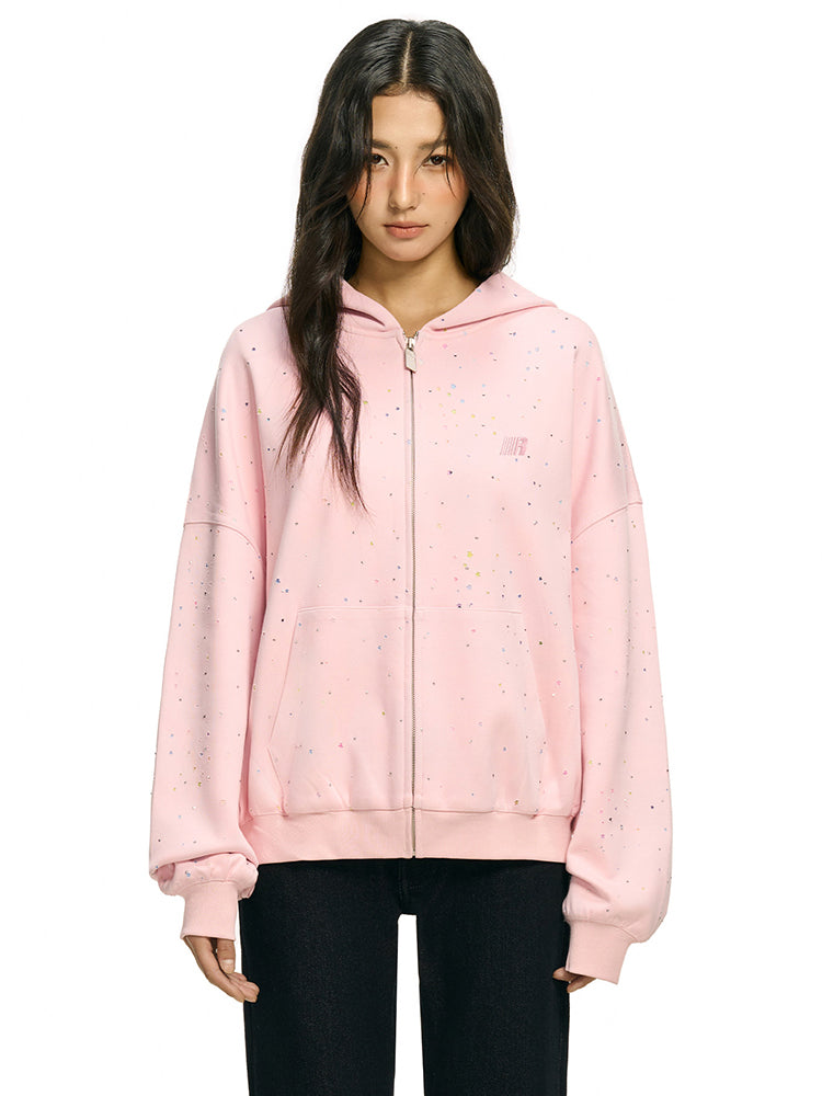 Front portrait of baggy pink confetti hoodie with signature star detailing