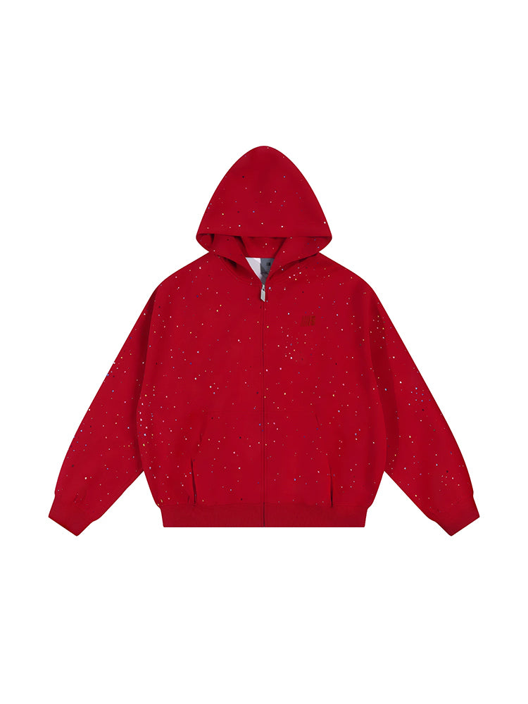 Front flat lay of red zip up hoodie with confetti dot detailing and star motif