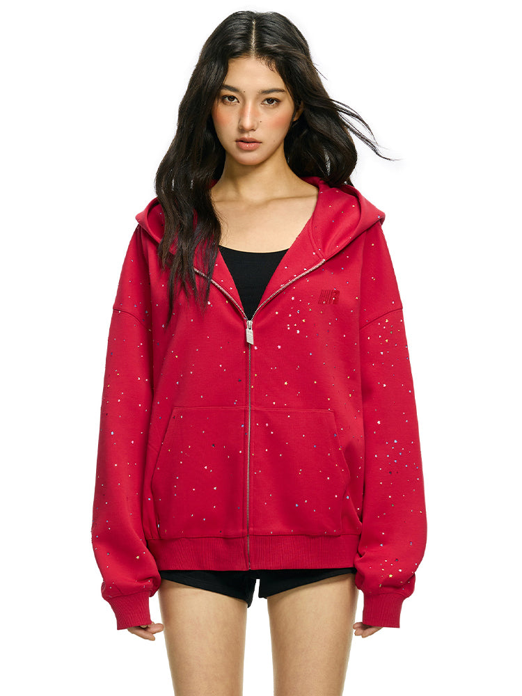 Streetwear styling of red rhinestone star hoodie with oversized fit on model