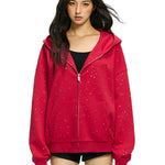 Streetwear styling of red rhinestone star hoodie with oversized fit on model