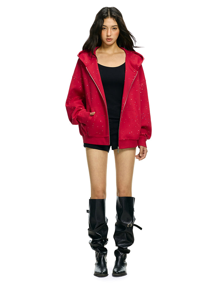 Front flat lay of red zip up hoodie with confetti dot detailing and star motif