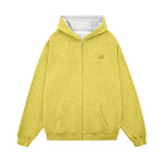 Flat lay of a yellow streetwear zip-up jacket with white contrast interior and drop shoulder design.