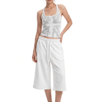 FDR Studios cyber Y2K white graphic halter neck cami with relaxed-fit white wide-leg cropped sweatpants.