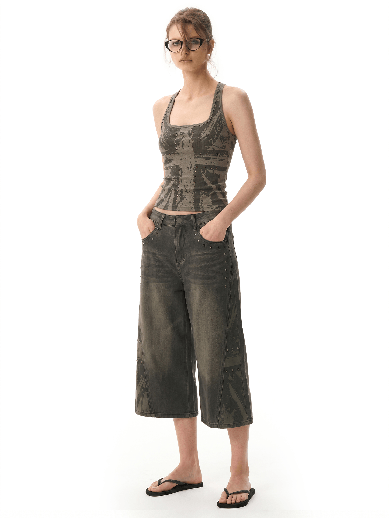 FDR Studios grunge industrial brown graphic halter top and faded washed mud-dyed wide-leg cropped culottes pants on model.