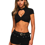 Front view of a woman wearing a black heart cutout twist front crop top.