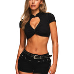 Close-up of the heart-shaped cutout and twist detail on a black streetwear top.