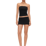 Full-body view of FDR Studios faded black seamless double-lined tube top and tight mini skirt two-piece set, industrial minimalist streetwear.