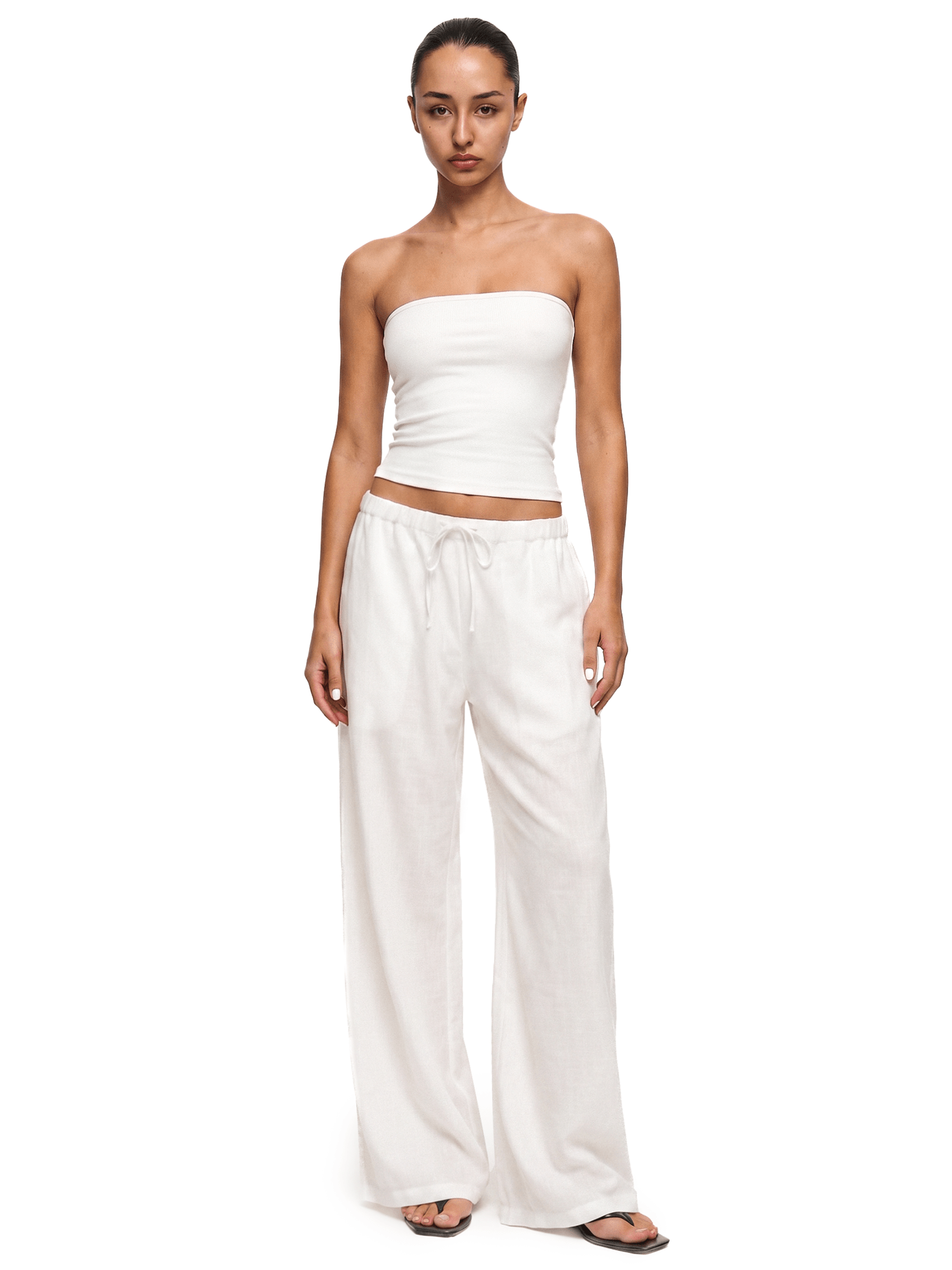 FDR Studios industrial minimalist cream white strapless tube top paired with matching off-white relaxed sweatpants.