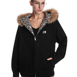 Cyber Y2K aesthetic black zip-up jacket with industrial minimalist fur hood design.