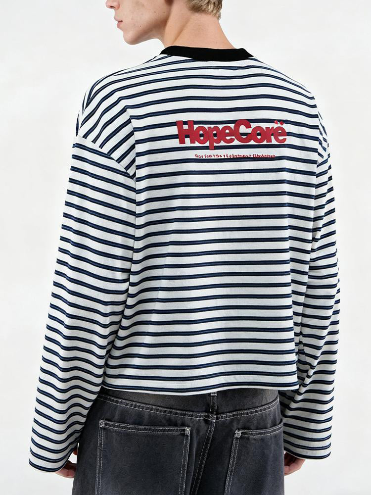 Close-up back view of FDR Studios striped long-sleeve tee featuring "HypeCord" red logo embroidery on the upper back.