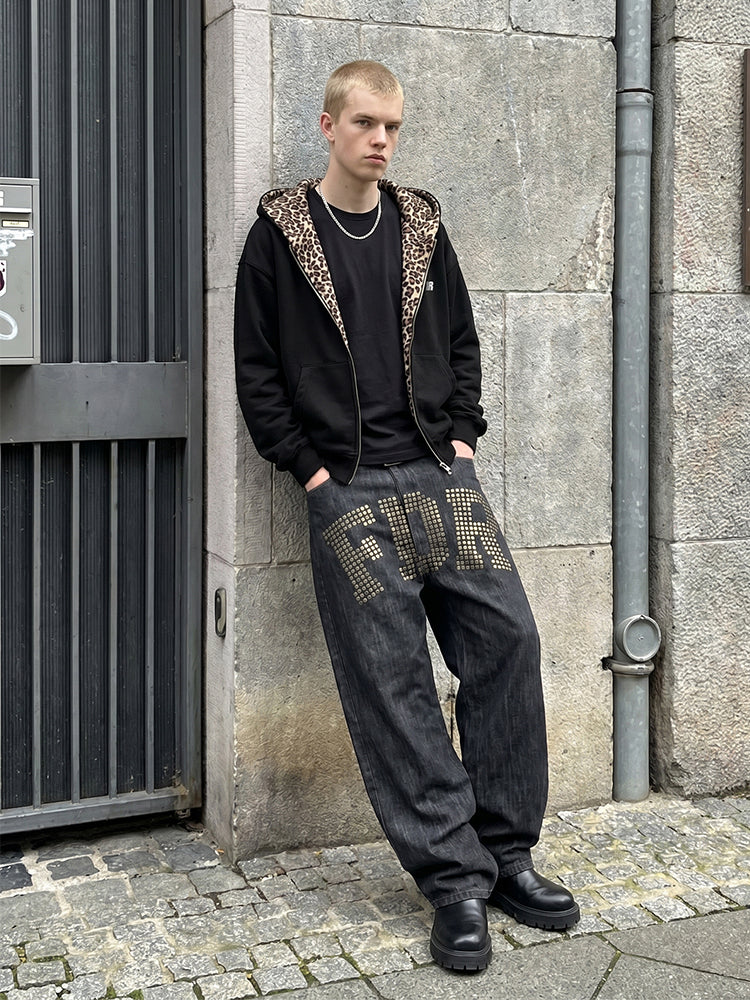 Heavyweight black oversized hoodie with leopard hood contrast on male model.