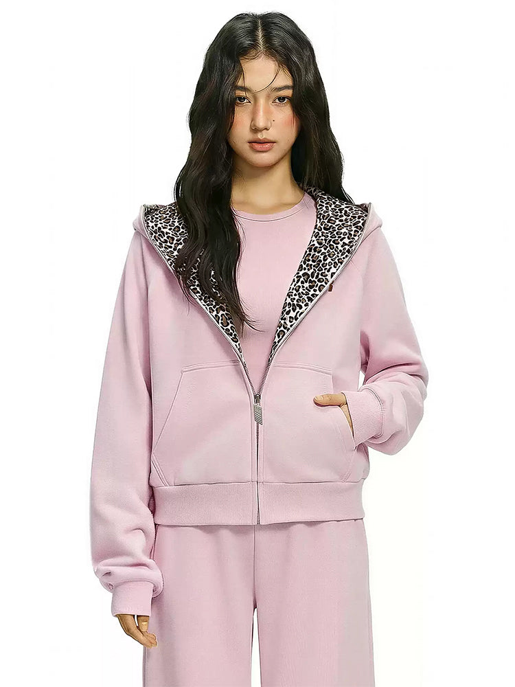 Pink high-neck fleece zip-up with contrasting leopard print hood interior.