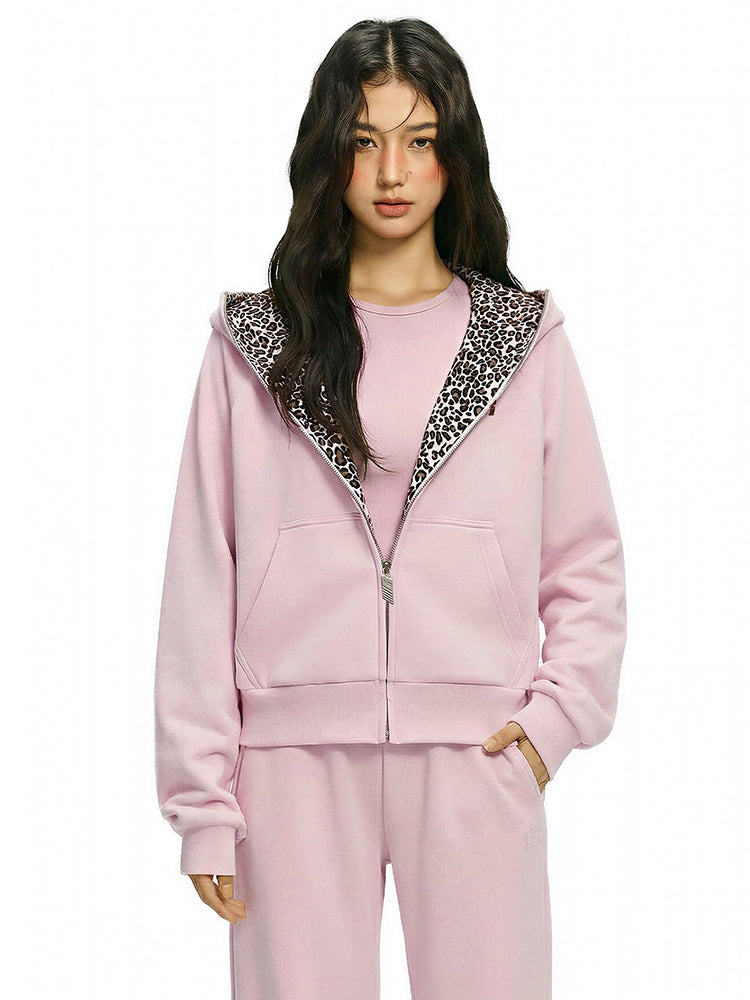 Profile view of FDR pink hoodie highlighting the oversized hood and cropped fit.
