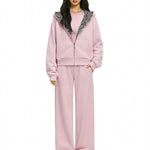 Matching pink Y2K lounge set with cropped hoodie and baggy lounge pants.