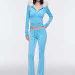 Front view of model wearing light blue Y2K plush zip hoodie with faux fur trim collar and matching flare pants