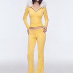 Model showcasing yellow cropped faux fur zip hoodie tracksuit set