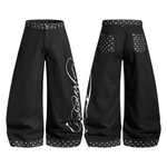 Product flat lay showing the front and back of black oversized wide-leg trousers with star and script embroidery.