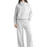 Model wearing the heather grey FDR half-zip hoodie with matching wide-leg sweatpants for a complete set.