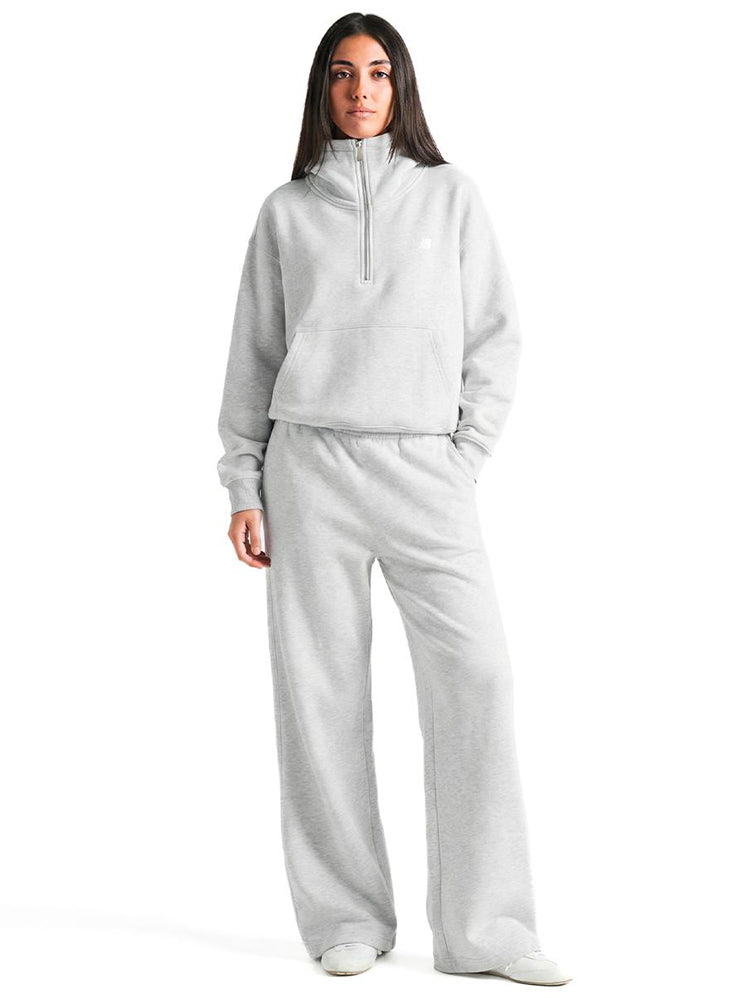 Model wearing the heather grey FDR half-zip hoodie with matching wide-leg sweatpants for a complete set.