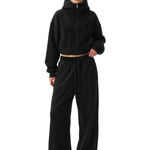 Industrial minimalist black cropped zip-up hoodie with oversized hood and relaxed fit silhouette.