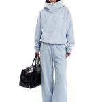 Side view of light blue Y2K style oversized hoodie and baggy pants set by FDR.