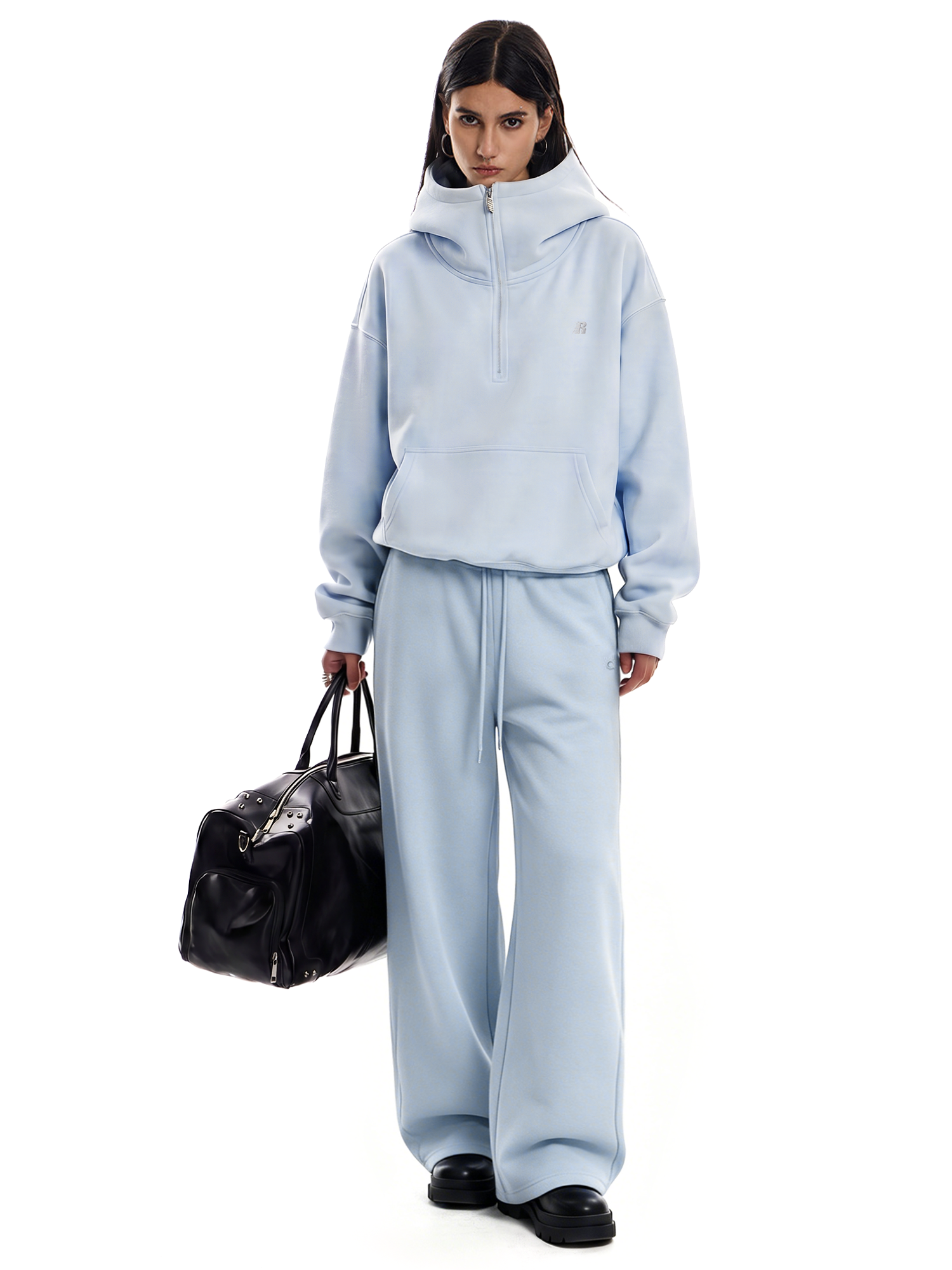 Side view of light blue Y2K style oversized hoodie and baggy pants set by FDR.